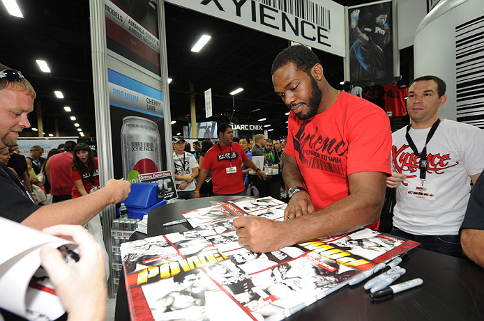 LAS VEGAS, NV - JULY 06:  UFC light heavyweight champion Jon "Bones" Jones signs autographs for fans at UFC Fan Expo on July 6, 2012 in Las Vegas, Nevada. (Photo by Al Powers /Zuffa LLC/Zuffa LLC via Getty Images) 