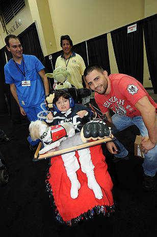 LAS VEGAS, NV - JULY 06:  Carlos Condit poses with fans at the UFC Fan Expo on July 6, 2012 in Las Vegas, Nevada. (Photo by Al Powers /Zuffa LLC/Zuffa LLC via Getty Images) *** Local Caption *** Carlos Condit