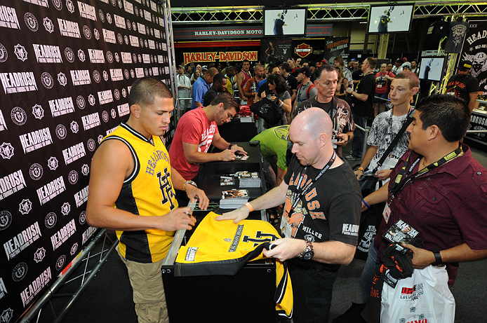 LAS VEGAS, NV - JULY 7: Anthony Pettis and Sam Stout sign autographs during the UFC Fan Expo at the Mandalay Bay Convention Center on July 7, 2012 in Las Vegas, Nevada. (Photo by Al Powers/Zuffa LLC/Zuffa LLC via Getty Images) *** Local Caption ***