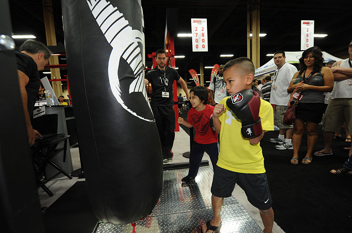 LAS VEGAS, NV - JULY 7: Fans try out the punch machine during the UFC Fan Expo at the Mandalay Bay Convention Center on July 7, 2012 in Las Vegas, Nevada. (Photo by Al Powers/Zuffa LLC/Zuffa LLC via Getty Images) *** Local Caption ***