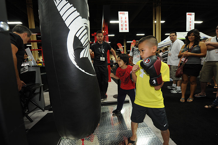 LAS VEGAS, NV - JULY 7:   Fans try out the punch machine during the UFC Fan Expo at the Mandalay Bay Convention Center on July 7, 2012 in Las Vegas, Nevada.  (Photo by Al Powers/Zuffa LLC/Zuffa LLC via Getty Images)  *** Local Caption *** 