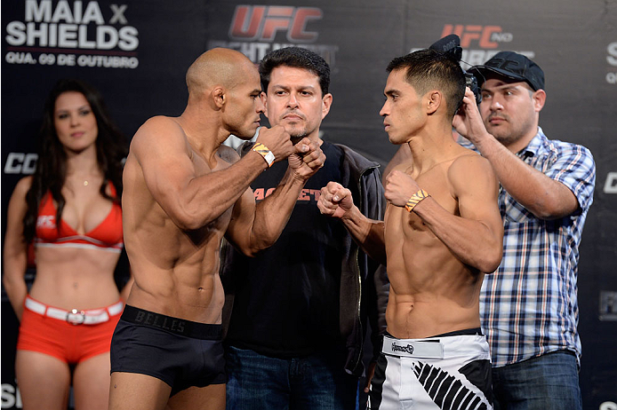 BARUERI, BRAZIL - OCTOBER 8:  (L-R) Iliarde Santos and Chris Cariaso face off during the UFC Fight Night: Maia v Shields weigh-in at the Ginasio Jose Correa on October 8, 2013 in Barueri, Sao Paulo, Brazil. (Photo by Jeff Bottari/Zuffa LLC/Zuffa LLC via G