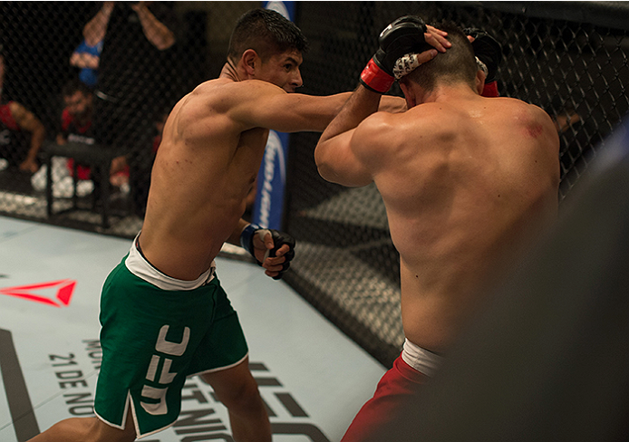 LAS VEGAS, NV - APRIL 10: (L-R) Hector Aldana punches Alvaro Herrera during the filming of The Ultimate Fighter Latin America: Team Gastelum vs Team Escudero on April 10, 2015 in Las Vegas, Nevada. (Photo by Brandon Magnus/Zuffa LLC/Zuffa LLC via Getty
