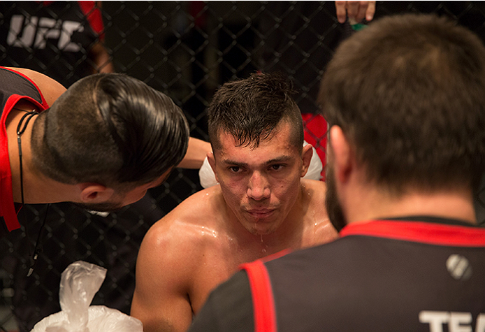 LAS VEGAS, NV - APRIL 10: Alvaro Herrera receives advice from his corner while facing Hector Aldana during the filming of The Ultimate Fighter Latin America: Team Gastelum vs Team Escudero on April 10, 2015 in Las Vegas, Nevada. (Photo by Brandon Magnus