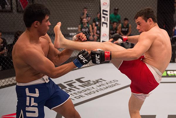LAS VEGAS, NV - APRIL 21: (R-L) Vernon Ramos kicks Erick Monta–o in their semi-finals fight during the filming of The Ultimate Fighter Latin America: Team Gastelum vs Team Escudero on April 21, 2015 in Las Vegas, Nevada. (Photo by Brandon Magnus/Zuffa LL