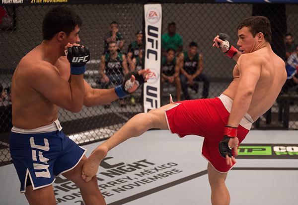 LAS VEGAS, NV - APRIL 21: (R-L) Vernon Ramos kicks Erick Monta–o in their semi-finals fight during the filming of The Ultimate Fighter Latin America: Team Gastelum vs Team Escudero on April 21, 2015 in Las Vegas, Nevada. (Photo by Brandon Magnus/Zuffa LL