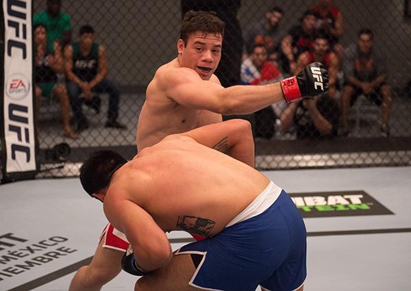 LAS VEGAS, NV - APRIL 21: (R-L) Vernon Ramos punches Erick Monta–o in their semi-finals fight during the filming of The Ultimate Fighter Latin America: Team Gastelum vs Team Escudero on April 21, 2015 in Las Vegas, Nevada. (Photo by Brandon Magnus/Zuffa
