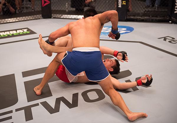 LAS VEGAS, NV - APRIL 21: Erick Monta–o (top) punches Vernon Ramos in their semi-finals fight during the filming of The Ultimate Fighter Latin America: Team Gastelum vs Team Escudero on April 21, 2015 in Las Vegas, Nevada. (Photo by Brandon Magnus/Zuffa