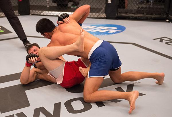 LAS VEGAS, NV - APRIL 21: Erick Monta–o (top) punches Vernon Ramos in their semi-finals fight during the filming of The Ultimate Fighter Latin America: Team Gastelum vs Team Escudero on April 21, 2015 in Las Vegas, Nevada. (Photo by Brandon Magnus/Zuffa