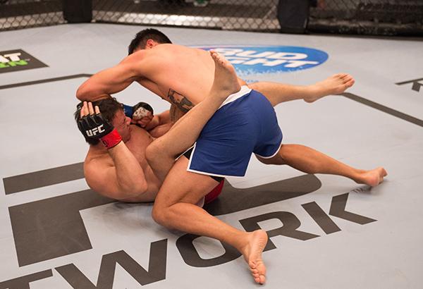 LAS VEGAS, NV - APRIL 21: Erick Monta–o (top) punches Vernon Ramos in their semi-finals fight during the filming of The Ultimate Fighter Latin America: Team Gastelum vs Team Escudero on April 21, 2015 in Las Vegas, Nevada. (Photo by Brandon Magnus/Zuffa