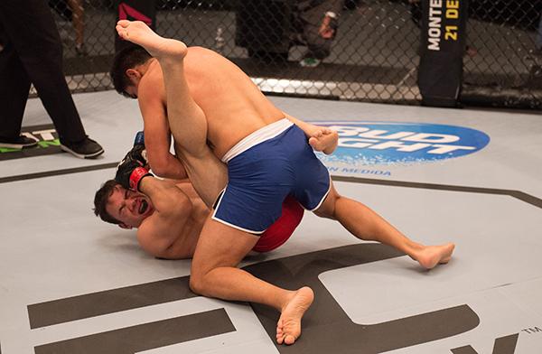LAS VEGAS, NV - APRIL 21: Erick Monta–o (top) punches Vernon Ramos in their semi-finals fight during the filming of The Ultimate Fighter Latin America: Team Gastelum vs Team Escudero on April 21, 2015 in Las Vegas, Nevada. (Photo by Brandon Magnus/Zuffa