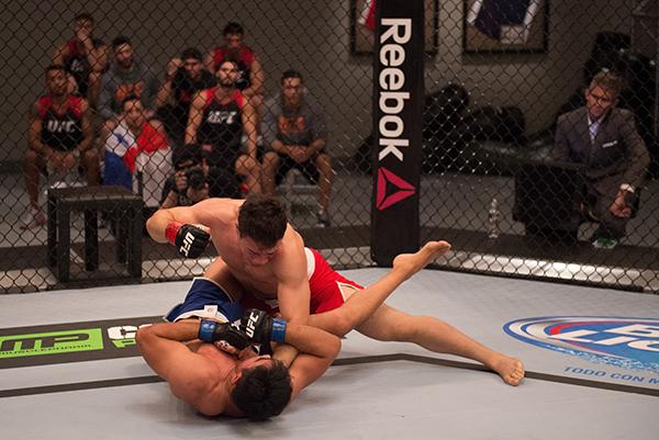 LAS VEGAS, NV - APRIL 21: Vernon Ramos (top) punches Erick Monta–o in their semi-finals fight during the filming of The Ultimate Fighter Latin America: Team Gastelum vs Team Escudero on April 21, 2015 in Las Vegas, Nevada. (Photo by Brandon Magnus/Zuffa