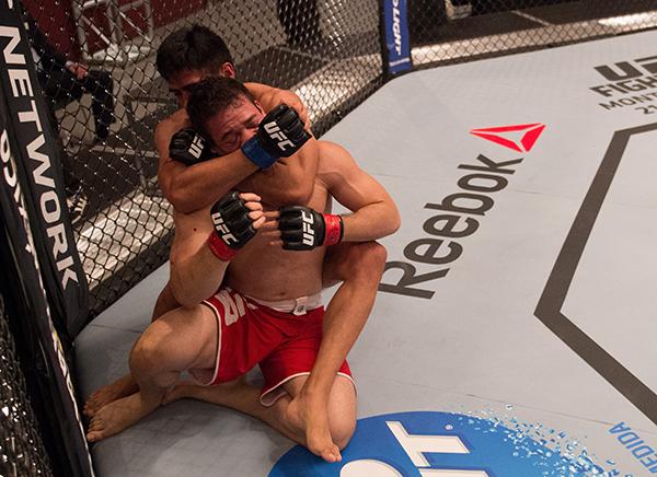 LAS VEGAS, NV - APRIL 21: (L-R) Erick Monta–o attempts to submit Vernon Ramos in their semi-finals fight during the filming of The Ultimate Fighter Latin America: Team Gastelum vs Team Escudero on April 21, 2015 in Las Vegas, Nevada. (Photo by Brandon Ma
