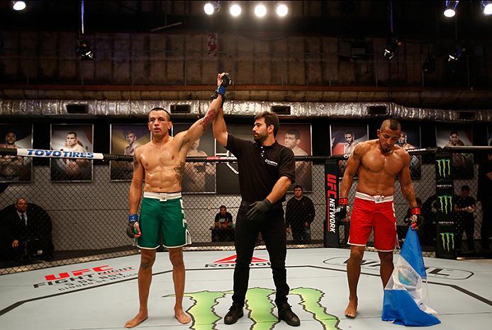 BUENOS AIRES, ARGENTINA - MAY 28: (L-R) Leonardo Rodriguez celebrates his victory over Yasser Castillo during the filming of The Ultimate Fighter Latin America: Team Liddell vs Team Griffin on May 28, 2016 in Buenos Aires, Argentina. (Photo by Gabriel Ro