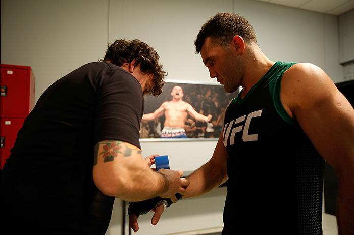 BUENOS AIRES, ARGENTINA - MAY 28: Javier Ganin puts on his gloves before facing Martin Bravo during the filming of The Ultimate Fighter Latin America: Team Liddell vs Team Griffin on May 28, 2016 in Buenos Aires, Argentina. (Photo by Gabriel Rossi/Zuffa