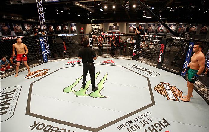 BUENOS AIRES, ARGENTINA - MAY 28: (L-R) Martin Bravo prepares for the round to begin before facing Javier Ganin during the filming of The Ultimate Fighter Latin America: Team Liddell vs Team Griffin on May 28, 2016 in Buenos Aires, Argentina. (Photo by G