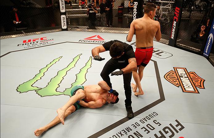 BUENOS AIRES, ARGENTINA - MAY 28: (L-R) Javier Ganin lays on the ground in pain after facing Martin Bravo during the filming of The Ultimate Fighter Latin America: Team Liddell vs Team Griffin on May 28, 2016 in Buenos Aires, Argentina. (Photo by Gabriel