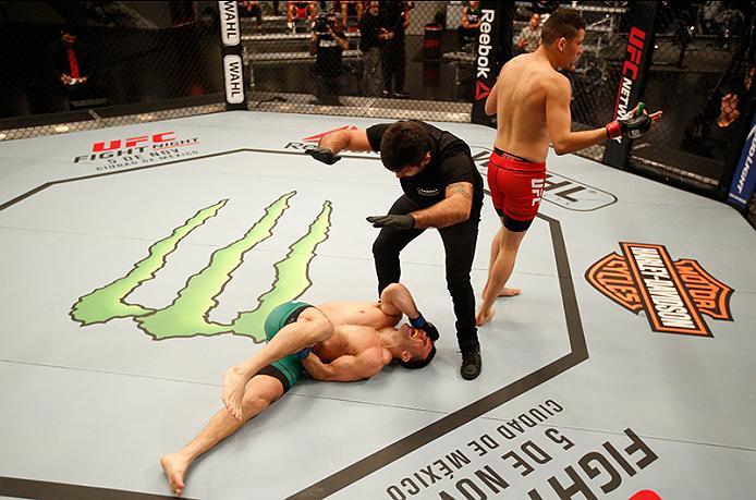 BUENOS AIRES, ARGENTINA - MAY 28: (L-R) Javier Ganin lays on the ground in pain after facing Martin Bravo during the filming of The Ultimate Fighter Latin America: Team Liddell vs Team Griffin on May 28, 2016 in Buenos Aires, Argentina. (Photo by Gabriel