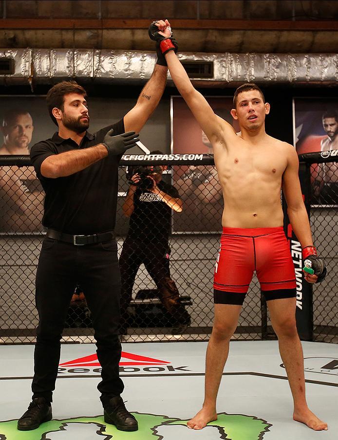 BUENOS AIRES, ARGENTINA - MAY 28: Martin Bravo celebrates his victory over Javier Ganin during the filming of The Ultimate Fighter Latin America: Team Liddell vs Team Griffin on May 28, 2016 in Buenos Aires, Argentina. (Photo by Gabriel Rossi/Zuffa LLC/Z