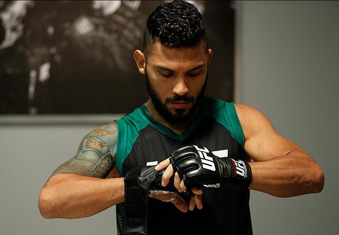 BUENOS AIRES, ARGENTINA - JUNE 4: Ilianovich Chalo puts on his gloves before facing Martin Bravo during the filming of The Ultimate Fighter Latin America: Team Liddell vs Team Griffin on June 4, 2016 in Buenos Aires, Argentina. (Photo by Gabriel Rossi/Zu
