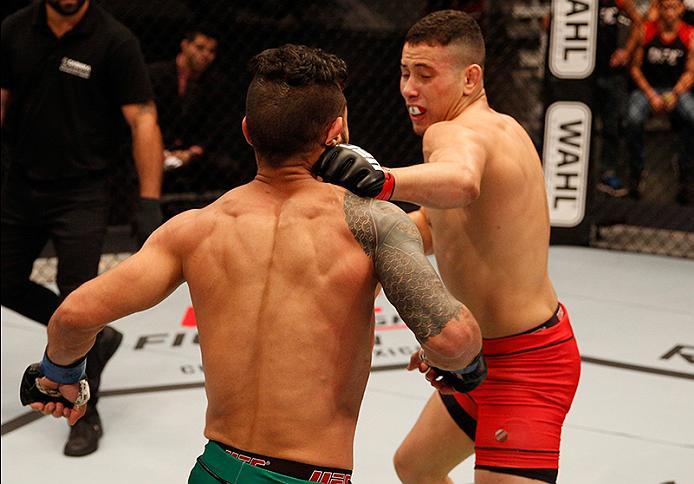 BUENOS AIRES, ARGENTINA - JUNE 4: (R-L) Martin Bravo punches Ilianovich Chalo during the filming of The Ultimate Fighter Latin America: Team Liddell vs Team Griffin on June 4, 2016 in Buenos Aires, Argentina. (Photo by Gabriel Rossi/Zuffa LLC/Zuffa LLC v
