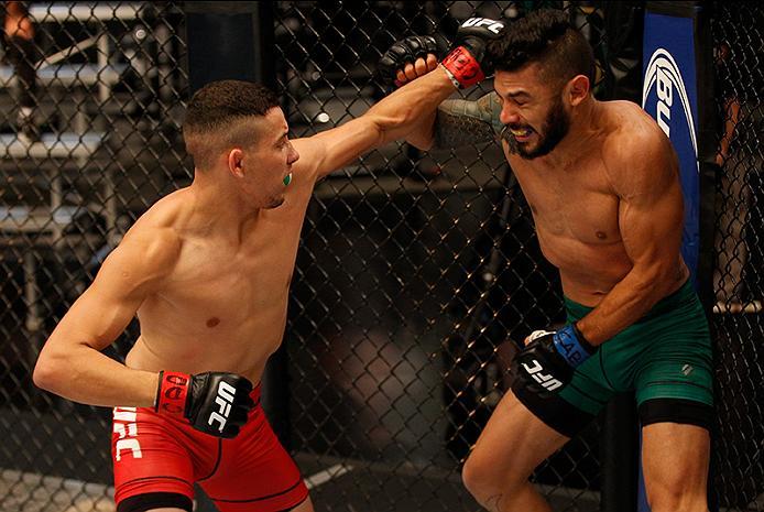 BUENOS AIRES, ARGENTINA - JUNE 4: (L-R) Martin Bravo punches Ilianovich Chalo during the filming of The Ultimate Fighter Latin America: Team Liddell vs Team Griffin on June 4, 2016 in Buenos Aires, Argentina. (Photo by Gabriel Rossi/Zuffa LLC/Zuffa LLC v