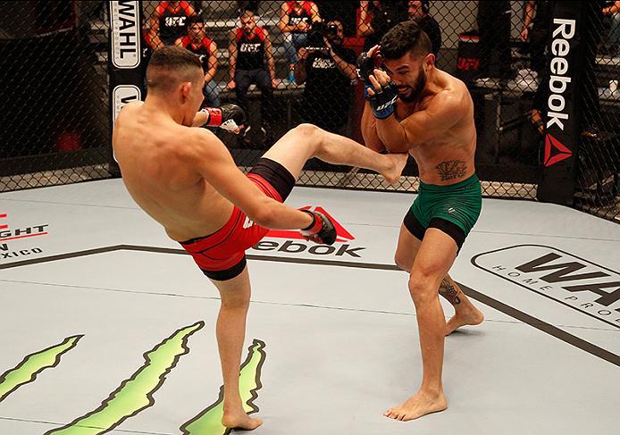 BUENOS AIRES, ARGENTINA - JUNE 4: (L-R) Martin Bravo kicks Ilianovich Chalo during the filming of The Ultimate Fighter Latin America: Team Liddell vs Team Griffin on June 4, 2016 in Buenos Aires, Argentina. (Photo by Gabriel Rossi/Zuffa LLC/Zuffa LLC via