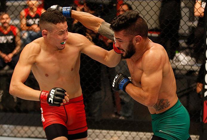 BUENOS AIRES, ARGENTINA - JUNE 4: (R-L) Ilianovich Chalo exchanges punches with Martin Bravo during the filming of The Ultimate Fighter Latin America: Team Liddell vs Team Griffin on June 4, 2016 in Buenos Aires, Argentina. (Photo by Gabriel Rossi/Zuffa