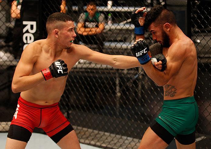 BUENOS AIRES, ARGENTINA - JUNE 4: (L-R) Martin Bravo punches Ilianovich Chalo during the filming of The Ultimate Fighter Latin America: Team Liddell vs Team Griffin on June 4, 2016 in Buenos Aires, Argentina. (Photo by Gabriel Rossi/Zuffa LLC/Zuffa LLC v