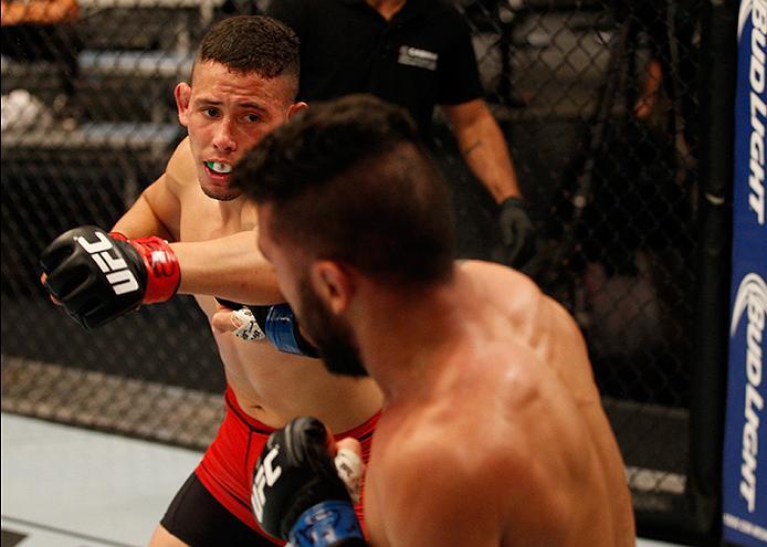 BUENOS AIRES, ARGENTINA - JUNE 4: (L-R) Martin Bravo punches Ilianovich Chalo during the filming of The Ultimate Fighter Latin America: Team Liddell vs Team Griffin on June 4, 2016 in Buenos Aires, Argentina. (Photo by Gabriel Rossi/Zuffa LLC/Zuffa LLC v
