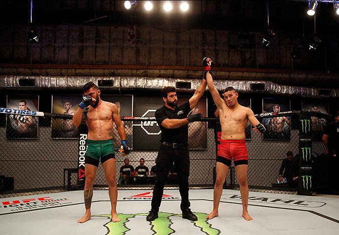 BUENOS AIRES, ARGENTINA - JUNE 4: (R-L) Martin Bravo celebrates his victory over Ilianovich Chalo during the filming of The Ultimate Fighter Latin America: Team Liddell vs Team Griffin on June 4, 2016 in Buenos Aires, Argentina. (Photo by Gabriel Rossi/Z