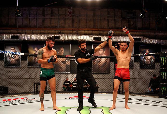 BUENOS AIRES, ARGENTINA - JUNE 4: (R-L) Martin Bravo celebrates his victory over Ilianovich Chalo during the filming of The Ultimate Fighter Latin America: Team Liddell vs Team Griffin on June 4, 2016 in Buenos Aires, Argentina. (Photo by Gabriel Rossi/Z