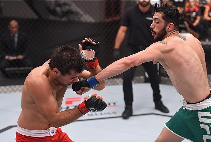 BUENOS AIRES, ARGENTINA - MAY 24: (R-L) John Bedoya punches Walter Zamora during the filming of The Ultimate Fighter Latin America: Team Liddell vs Team Griffin on May 24, 2016 in Buenos Aires, Argentina. (Photo by Amilcar Orfali/Zuffa LLC/Zuffa LLC via