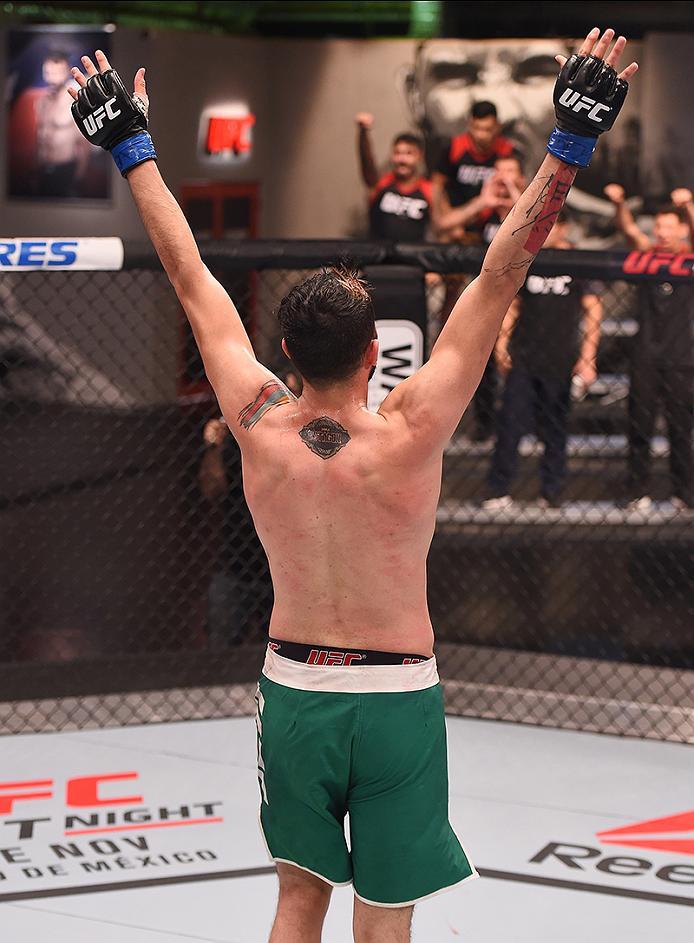 BUENOS AIRES, ARGENTINA - MAY 24: John Bedoya raises his hands after facing Walter Zamora during the filming of The Ultimate Fighter Latin America: Team Liddell vs Team Griffin on May 24, 2016 in Buenos Aires, Argentina. (Photo by Amilcar Orfali/Zuffa LL
