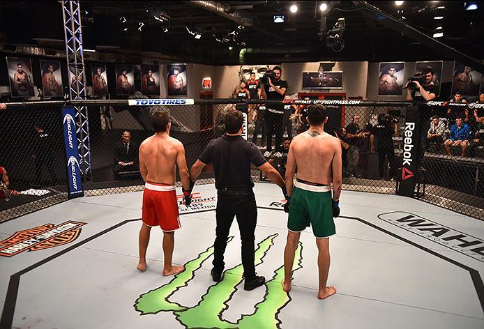 BUENOS AIRES, ARGENTINA - MAY 24: (R-L) John Bedoya and Walter Zamora wait to hear the judges decision during the filming of The Ultimate Fighter Latin America: Team Liddell vs Team Griffin on May 24, 2016 in Buenos Aires, Argentina. (Photo by Amilcar Or