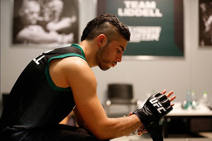 BUENOS AIRES, ARGENTINA - MAY 26: Juan Villaseca puts on his gloves before facing Marcelo Rojo during the filming of The Ultimate Fighter Latin America: Team Liddell vs Team Griffin on May 26, 2016 in Buenos Aires, Argentina. (Photo by Gabriel Rossi/Zuff
