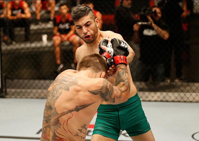 BUENOS AIRES, ARGENTINA - MAY 26: (R-L) Juan Villaseca punches Marcelo Rojo during the filming of The Ultimate Fighter Latin America: Team Liddell vs Team Griffin on May 26, 2016 in Buenos Aires, Argentina. (Photo by Gabriel Rossi/Zuffa LLC/Zuffa LLC via