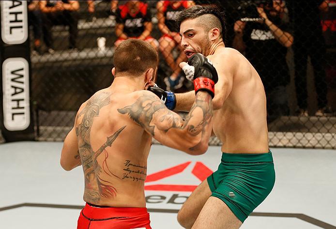 BUENOS AIRES, ARGENTINA - MAY 26: (R-L) Juan Villaseca punches Marcelo Rojo during the filming of The Ultimate Fighter Latin America: Team Liddell vs Team Griffin on May 26, 2016 in Buenos Aires, Argentina. (Photo by Gabriel Rossi/Zuffa LLC/Zuffa LLC via