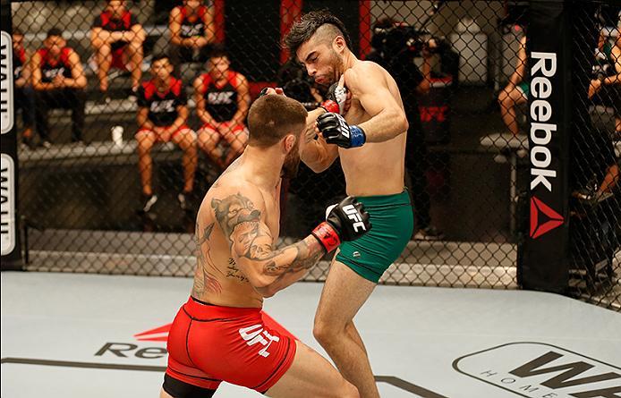 BUENOS AIRES, ARGENTINA - MAY 26: (L-R) Marcelo Rojo punches Juan Villaseca during the filming of The Ultimate Fighter Latin America: Team Liddell vs Team Griffin on May 26, 2016 in Buenos Aires, Argentina. (Photo by Gabriel Rossi/Zuffa LLC/Zuffa LLC via