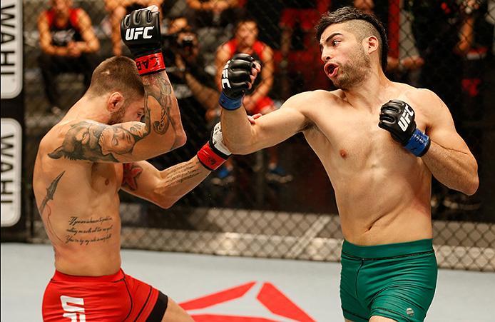 BUENOS AIRES, ARGENTINA - MAY 26: (R-L) Juan Villaseca punches Marcelo Rojo during the filming of The Ultimate Fighter Latin America: Team Liddell vs Team Griffin on May 26, 2016 in Buenos Aires, Argentina. (Photo by Gabriel Rossi/Zuffa LLC/Zuffa LLC via