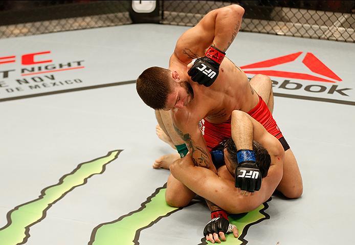 BUENOS AIRES, ARGENTINA - MAY 26: Marcelo Rojo (top) punches Juan Villaseca during the filming of The Ultimate Fighter Latin America: Team Liddell vs Team Griffin on May 26, 2016 in Buenos Aires, Argentina. (Photo by Gabriel Rossi/Zuffa LLC/Zuffa LLC via