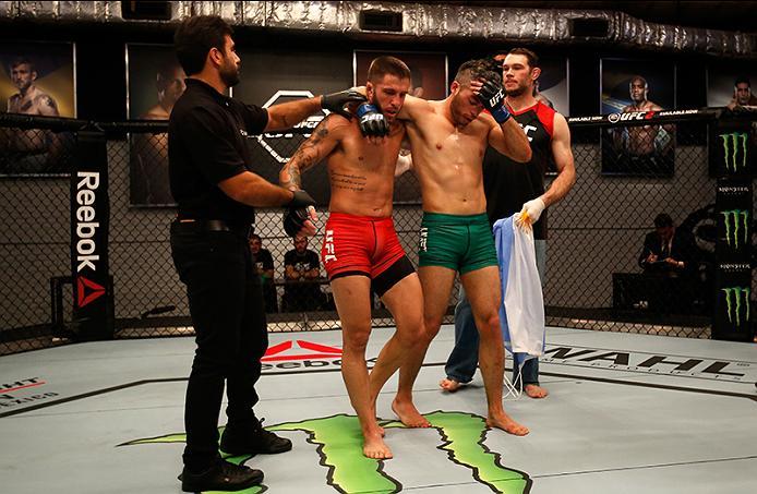 BUENOS AIRES, ARGENTINA - MAY 26: (L-R) Marcelo Rojo celebrates his submission victory over Juan Villaseca during the filming of The Ultimate Fighter Latin America: Team Liddell vs Team Griffin on May 26, 2016 in Buenos Aires, Argentina. (Photo by Gabrie