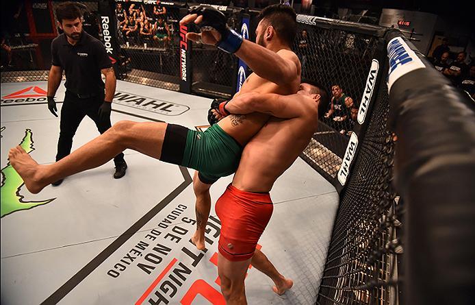 BUENOS AIRES, ARGENTINA - MAY 24: (R-L) Miguel Villegas takes down Ilianovich Chalo during the filming of The Ultimate Fighter Latin America: Team Liddell vs Team Griffin on May 24, 2016 in Buenos Aires, Argentina. (Photo by Amilcar Orfali/Zuffa LLC/Zuff