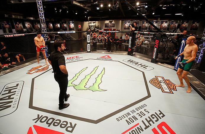 BUENOS AIRES, ARGENTINA - MAY 28: (L-R) Alejandro Martinez prepares for the round to begin before facing Fabian Quintana during the filming of The Ultimate Fighter Latin America: Team Liddell vs Team Griffin on May 28, 2016 in Buenos Aires, Argentina. (P