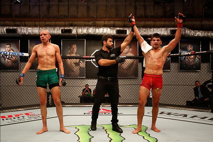 BUENOS AIRES, ARGENTINA - MAY 28:  (R-L) Alejandro Martinez celebrates his victory over Fabian Quintana during the filming of The Ultimate Fighter Latin America: Team Liddell vs Team Griffin on May 28, 2016 in Buenos Aires, Argentina. (Photo by Gabriel Ro