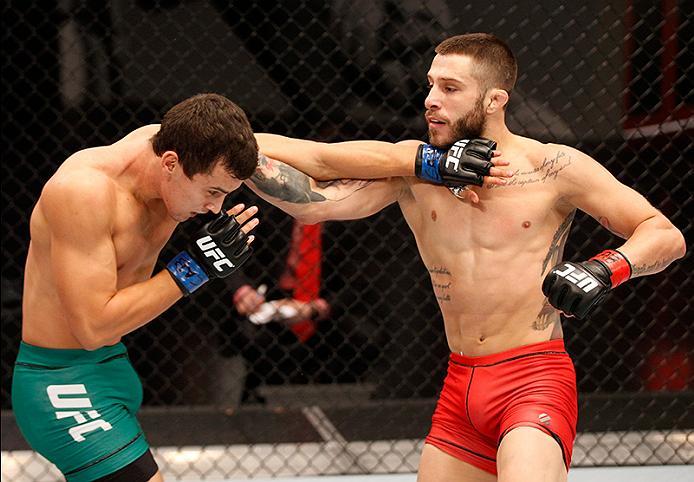 BUENOS AIRES, ARGENTINA - JUNE 11: (R-L) Marcelo Rojo punches Claudio Puelles during the filming of The Ultimate Fighter Latin America: Team Liddell vs Team Griffin on June 11, 2016 in Buenos Aires, Argentina. (Photo by Gabriel Rossi/Zuffa LLC/Zuffa LLC