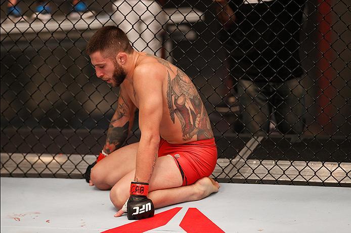 BUENOS AIRES, ARGENTINA - JUNE 11: Marcelo Rojo catches his breath in-between rounds while facing Claudio Puelles during the filming of The Ultimate Fighter Latin America: Team Liddell vs Team Griffin on June 11, 2016 in Buenos Aires, Argentina. (Photo b