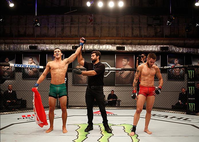 BUENOS AIRES, ARGENTINA - JUNE 11: (L-R) Claudio Puelles celebrates his victory over Marcelo Rojo during the filming of The Ultimate Fighter Latin America: Team Liddell vs Team Griffin on June 11, 2016 in Buenos Aires, Argentina. (Photo by Gabriel Rossi/