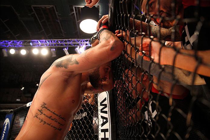BUENOS AIRES, ARGENTINA - JUNE 11: Marcelo Rojo receives advice from his corner in-between rounds after facing Claudio Puelles during the filming of The Ultimate Fighter Latin America: Team Liddell vs Team Griffin on June 11, 2016 in Buenos Aires, Argent
