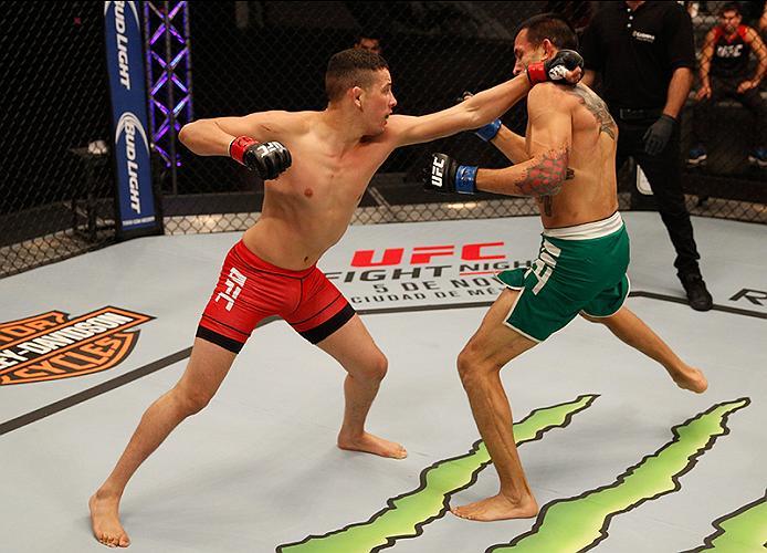 BUENOS AIRES, ARGENTINA - JUNE 11: (L-R) Martin Bravo punches Leonardo Rodriguez during the filming of The Ultimate Fighter Latin America: Team Liddell vs Team Griffin on June 11, 2016 in Buenos Aires, Argentina. (Photo by Gabriel Rossi/Zuffa LLC/Zuffa L